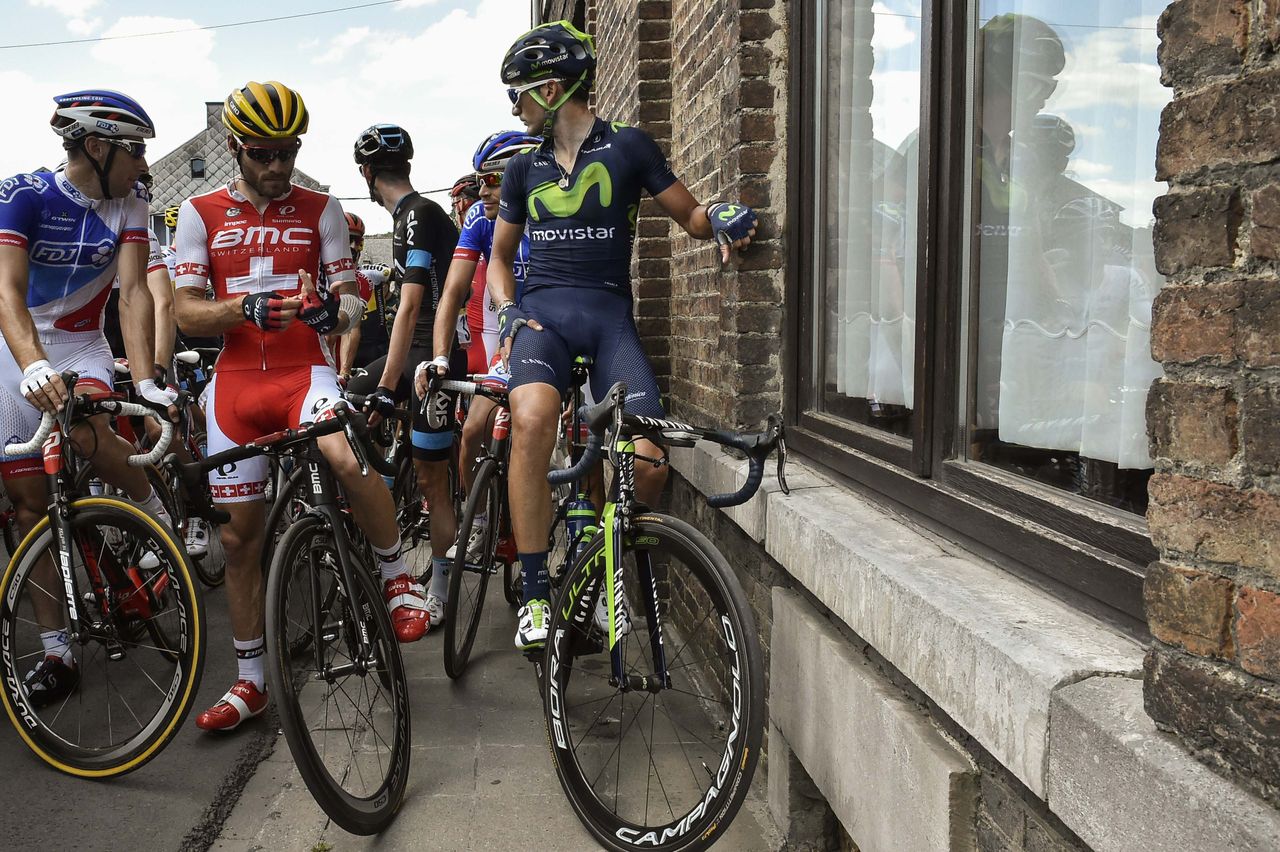 The riders wait for the stage to start again
