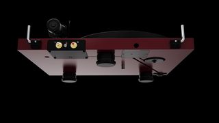 Pro-Ject Debut Evo 2 in wine red satin finish showing underside against black background