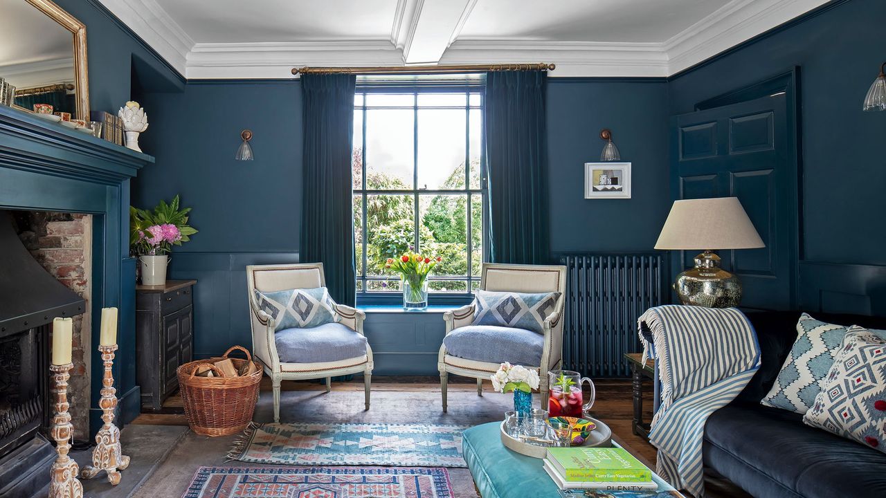 traditional sitting room with sat window and blue walls