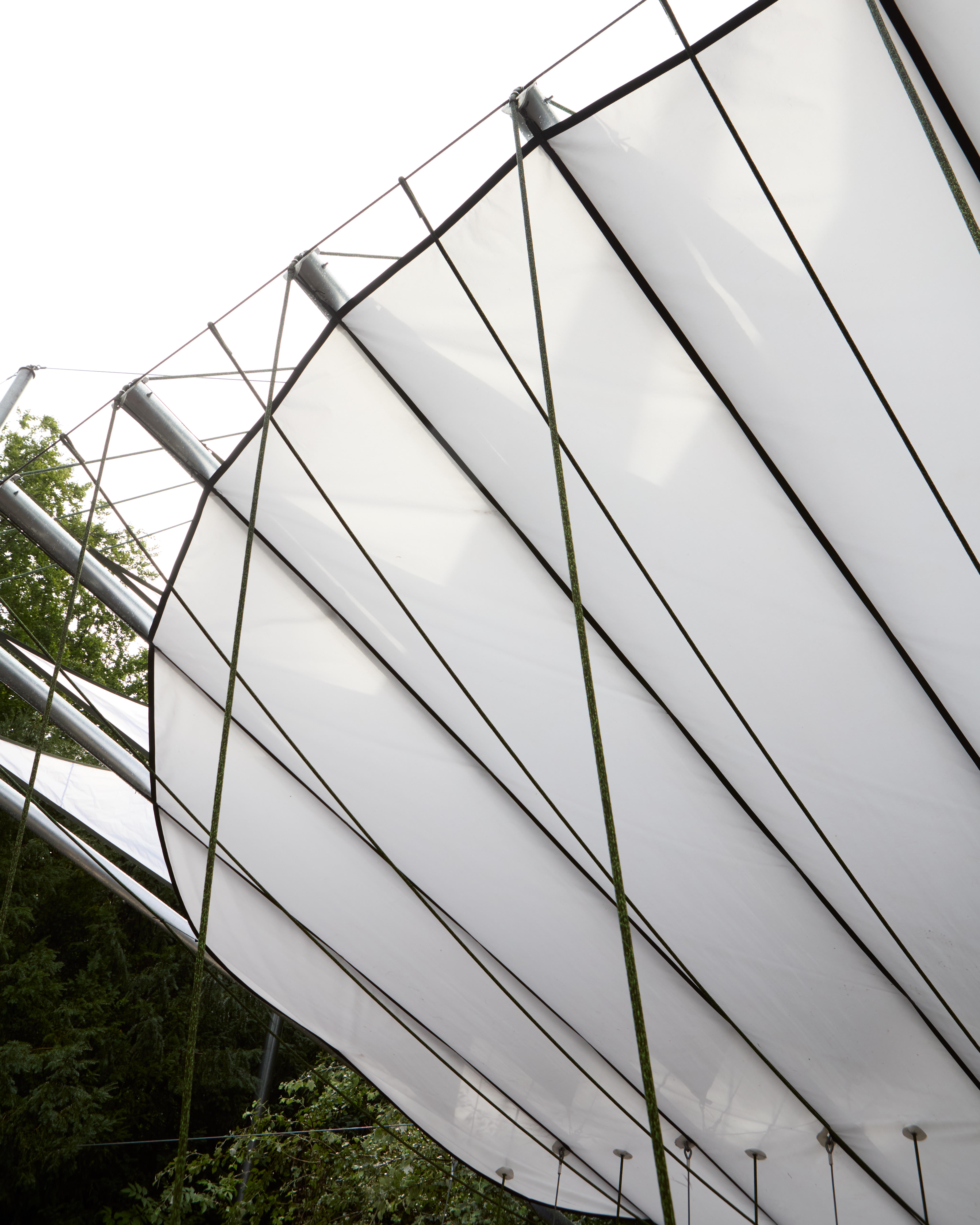 At Dekmantel Festival, a white tent over a stage in the woods