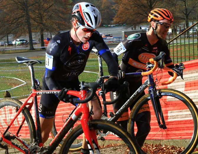 Riders are off their bikes and heading back on course