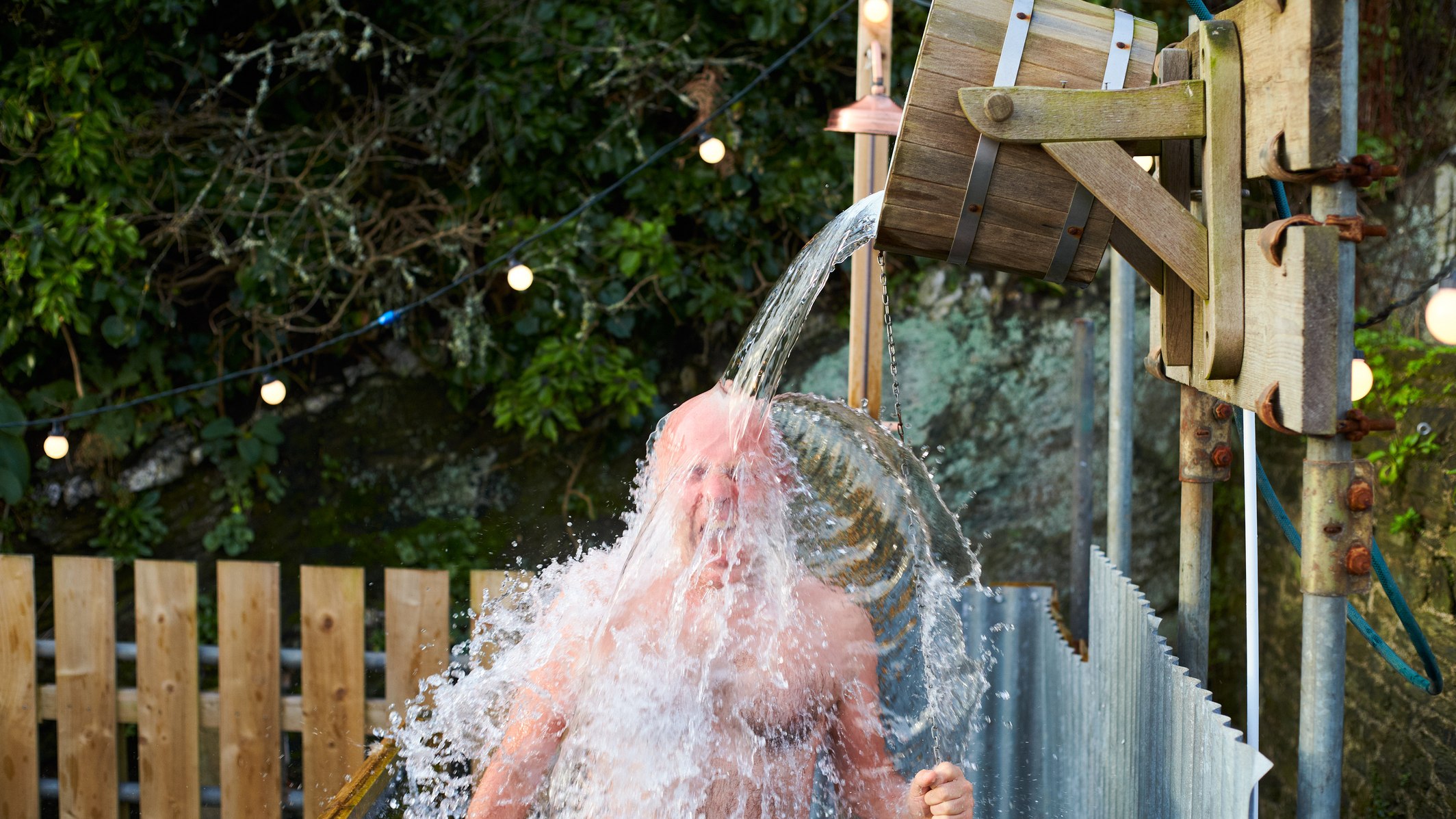 Man taking cold shower