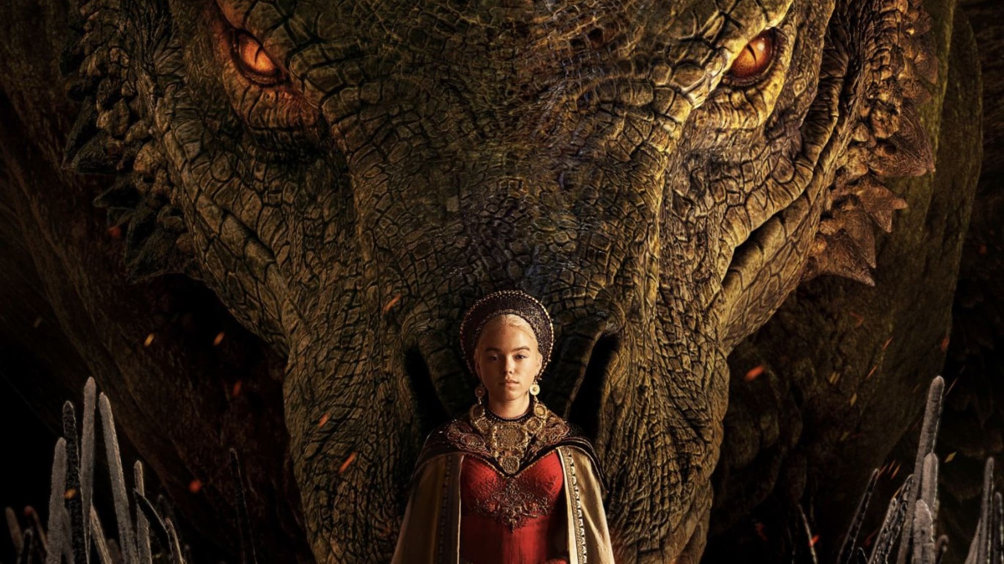 Milly Alcock stands in front of a dragon in House of the Dragon