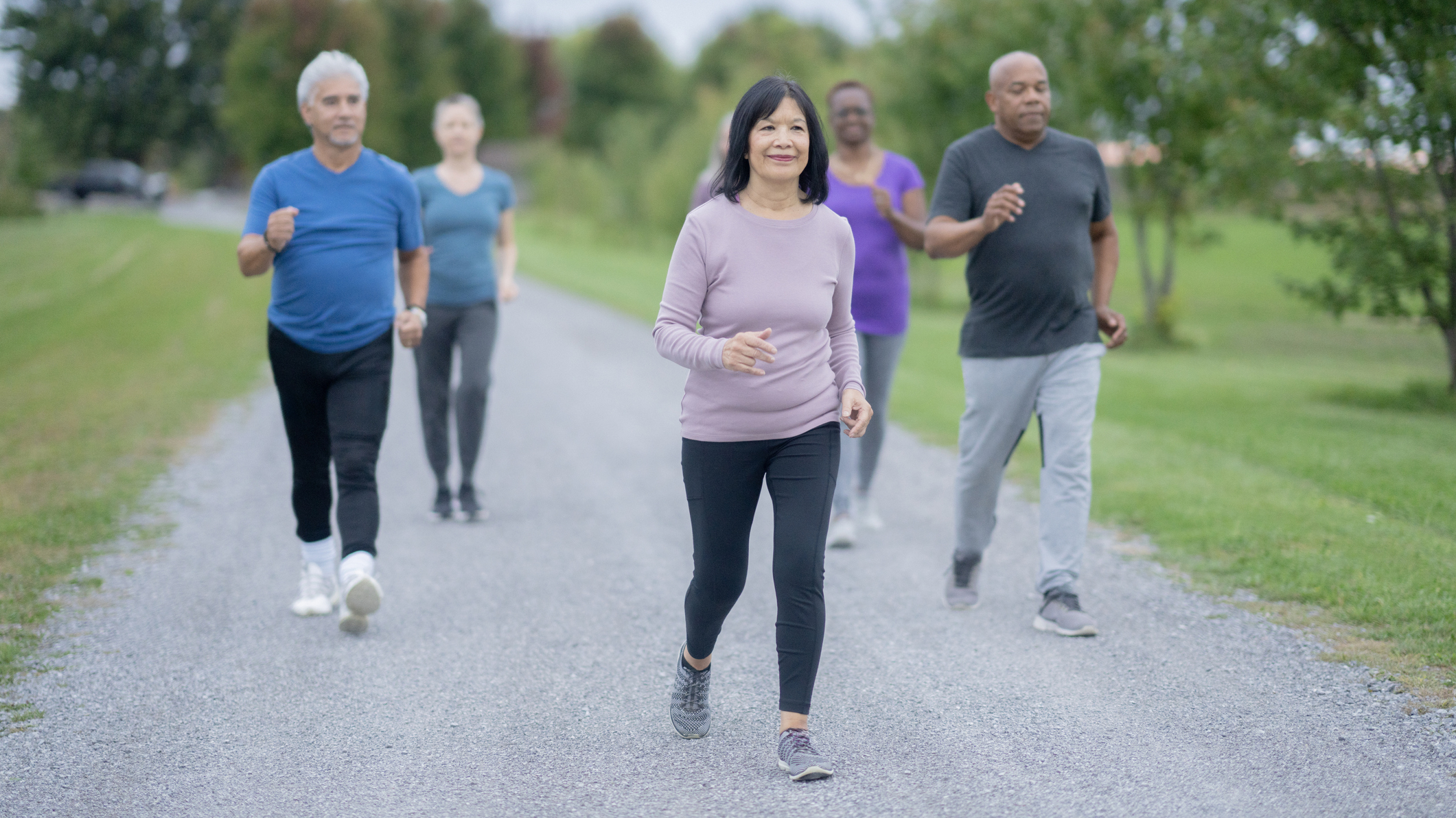 Group of people walking in a park