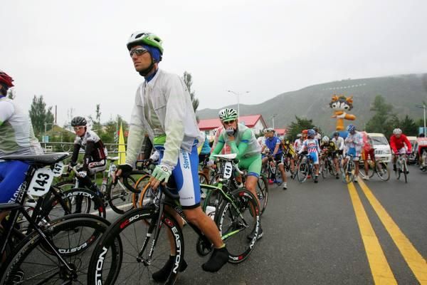At the sign on riders were preparing for a wet day on the saddle.