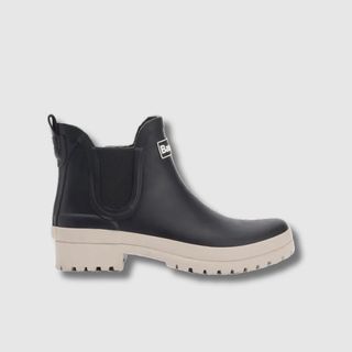 A black and white Barbour Mallow welly boot against a light grey background