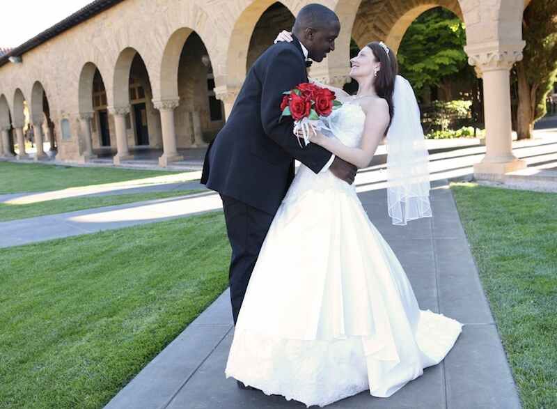 A bride and groom get wedding pictures taken.