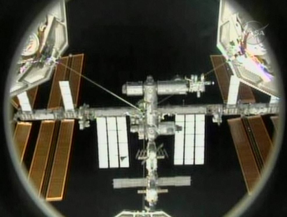 Shuttle Discovery Docks at Space Station