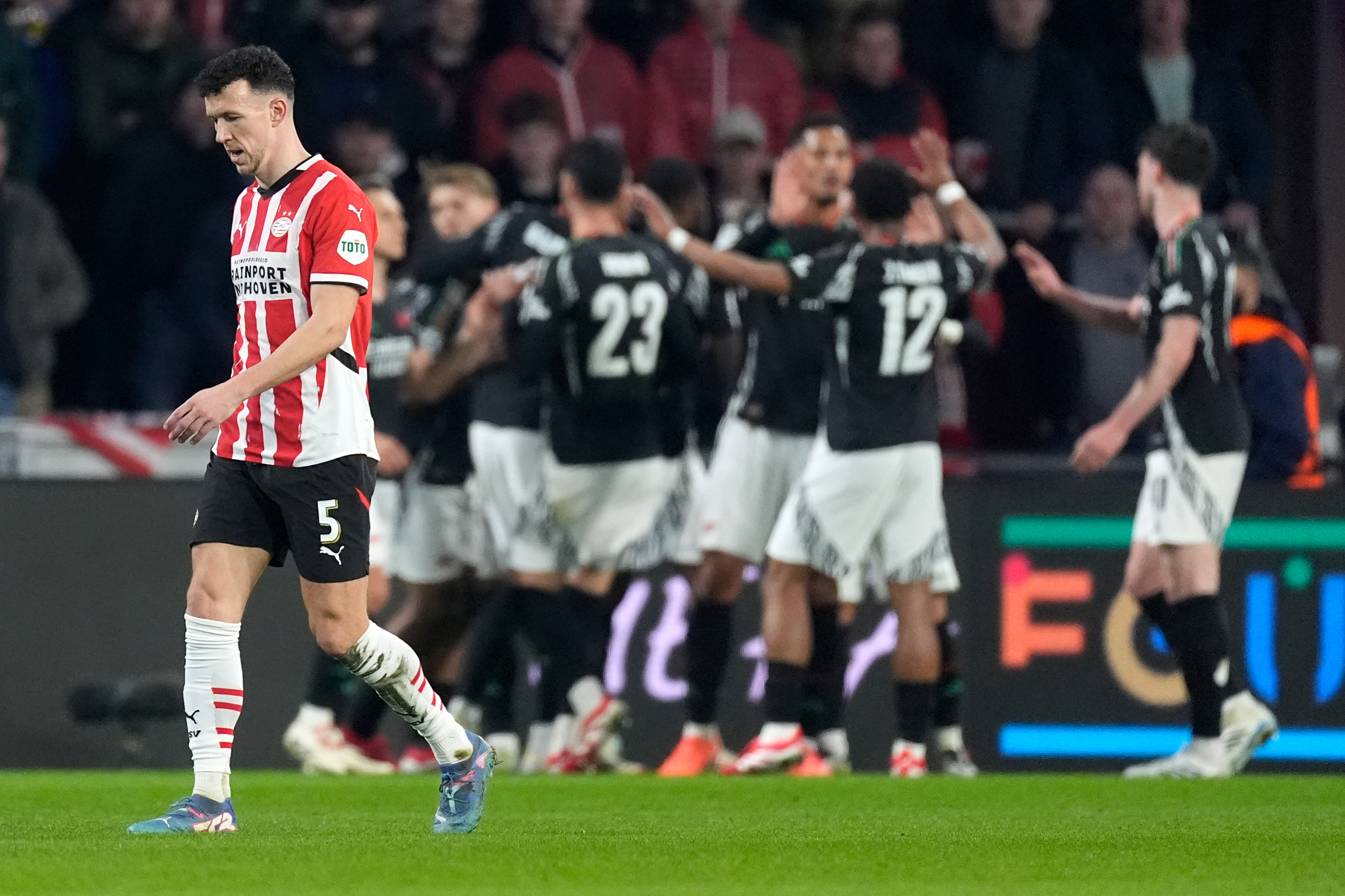 Arsenal players celebrate a goal against PSV in the Champions League in March 2025.