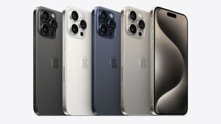 Five iPhone 15 Pro Max devices side by side, showing all of the available colours.