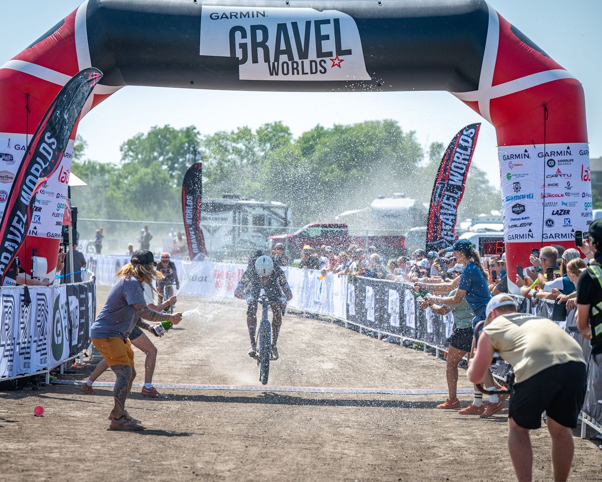 Simen Nordahl Svendsen (PAS Racing) gets a celebration shower for men's win at 2024 Gravel Worlds
