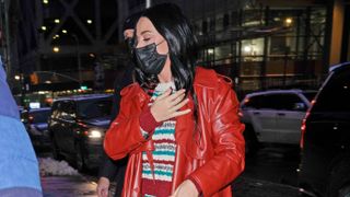 Katy Perry red leather coat and striped dress