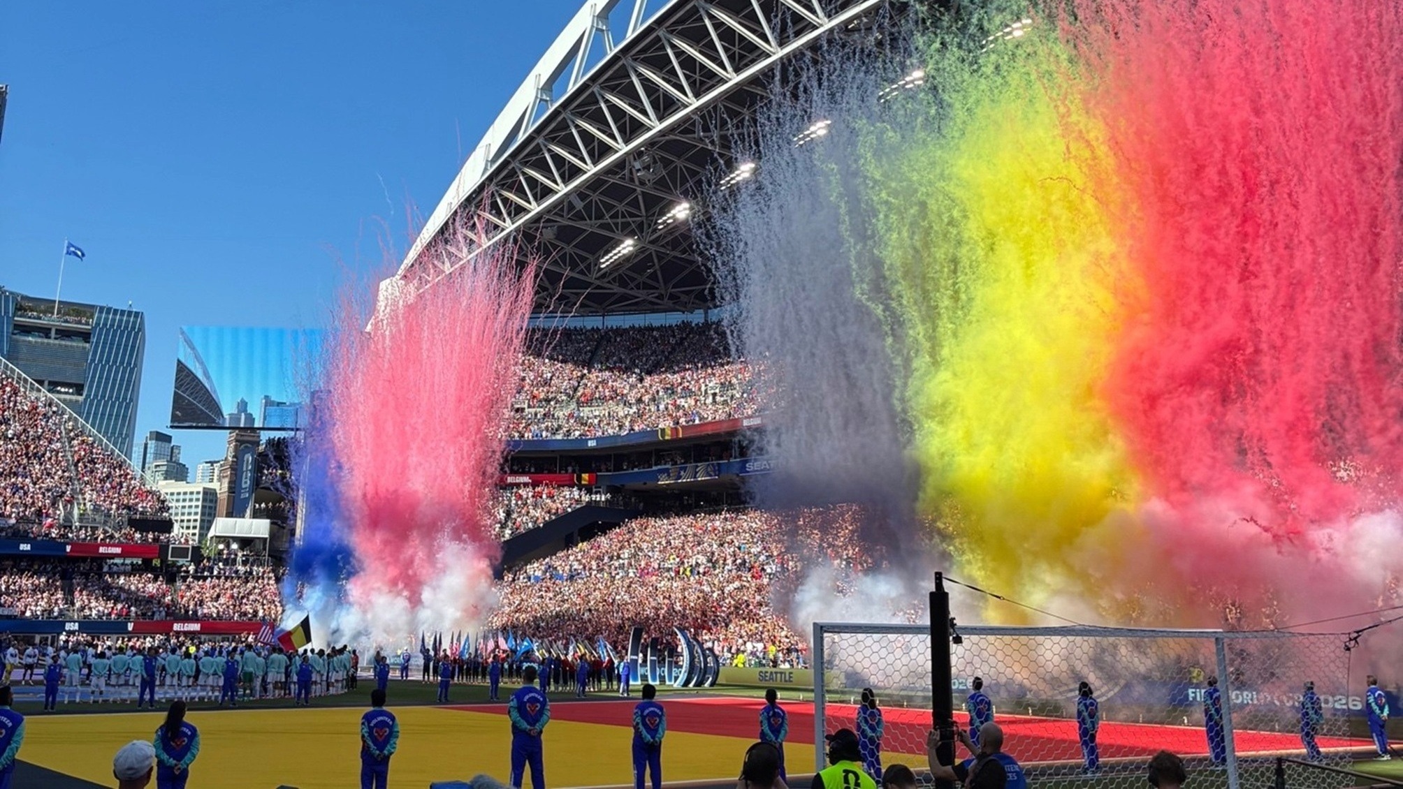 Colored smoke representing the Belgian and US flags at a FIFA World Cup 2026 match in Seattle