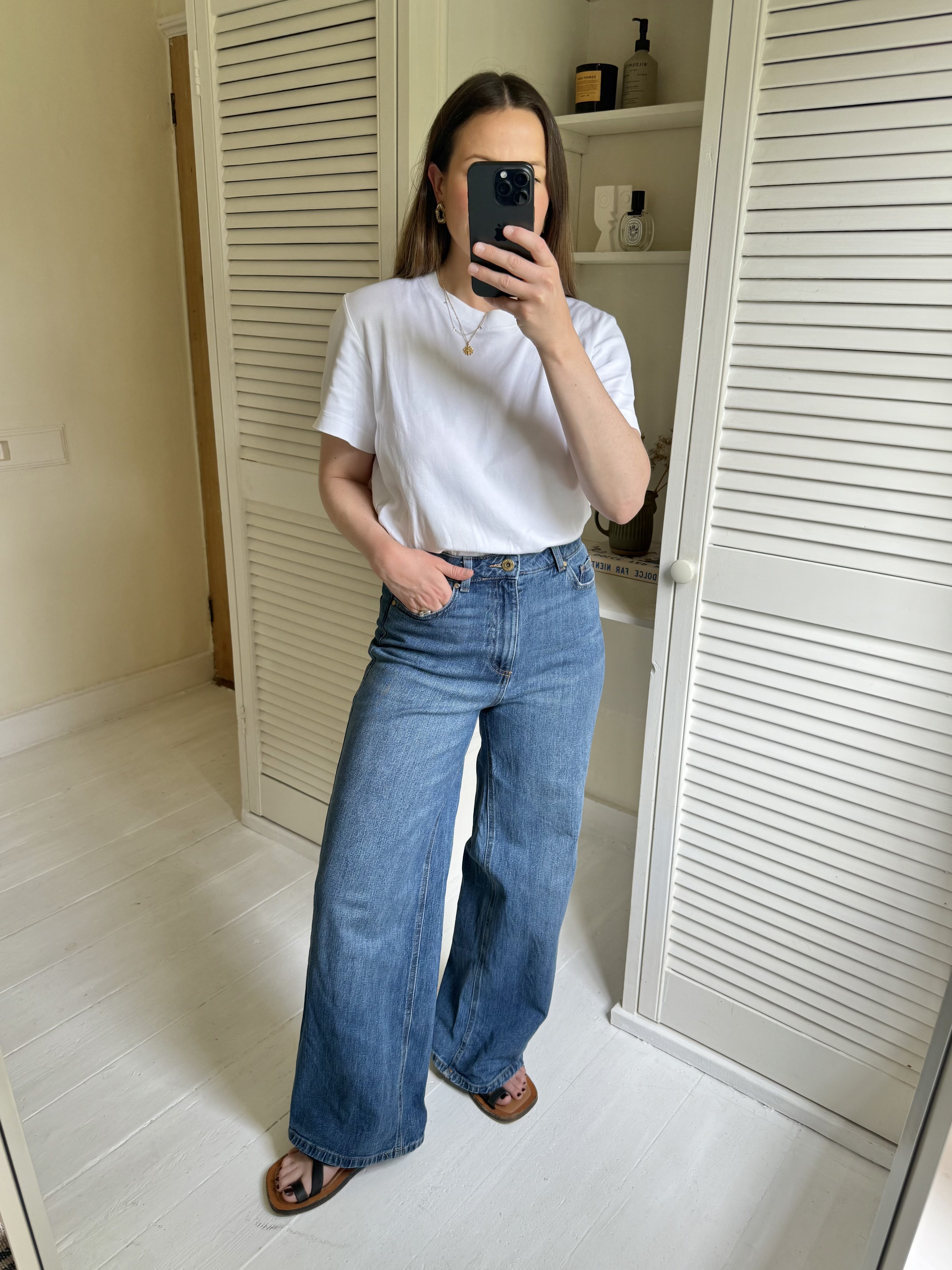 Woman tries on M&S Wide Leg Jeans
