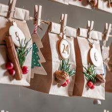 Creative advent Calendar for Christmas as countdown on the background of gray wall