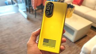Trump Phone T1 held in the hand.