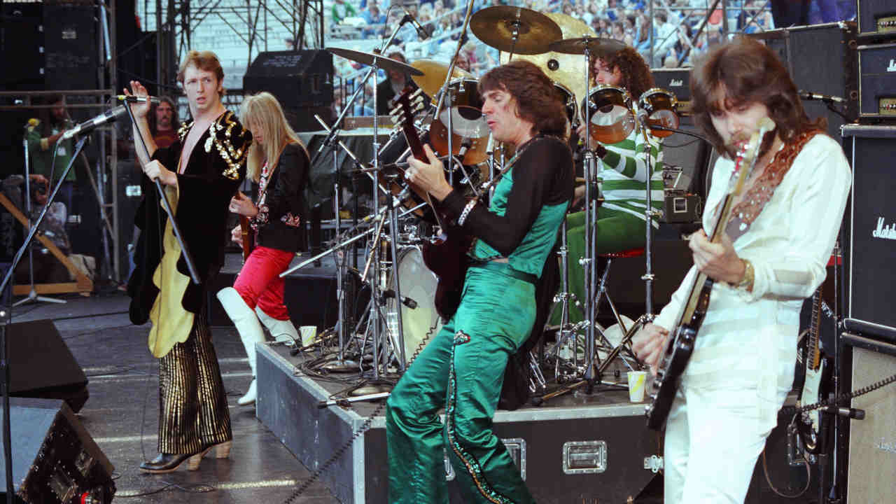 Judas Priest performing onstage in the 1970s