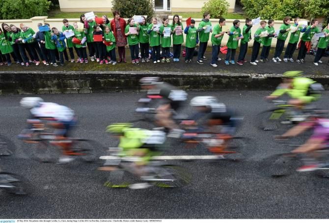 The peloton rides through Corofin, Co. Clare