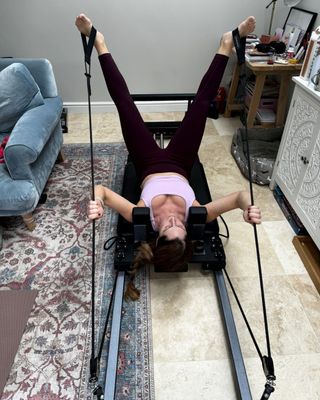 Anna trying the Reformer machine at home