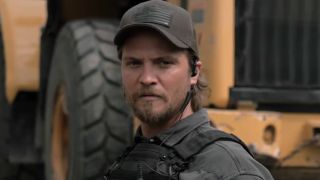 Kayce Dutton standing in front of construction equipment in Marshals Season 1