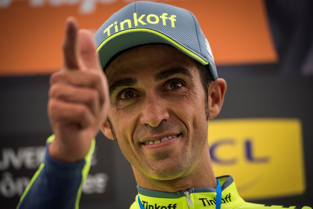 Alberto Contador celebrates on the podium after the Criterium du Dauphine prologue.