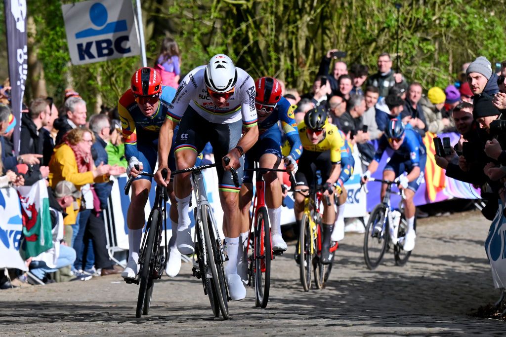 WEVELGEM BELGIUM MARCH 24 LR Mads Pedersen of Denmark and Team Lidl Trek and Mathieu van der Poel of The Netherlands and Team Alpecin Deceuninck attack in the Baneberg cobblestones sector during the 86th GentWevelgem in Flanders Fields 2024 Mens Elite a 2531km one day race from Ieper to Wevelgem UCIWT on March 24 2024 in Wevelgem Belgium Photo by Tim de WaeleGetty Images
