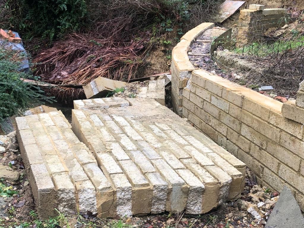 A collapsed wall at the property