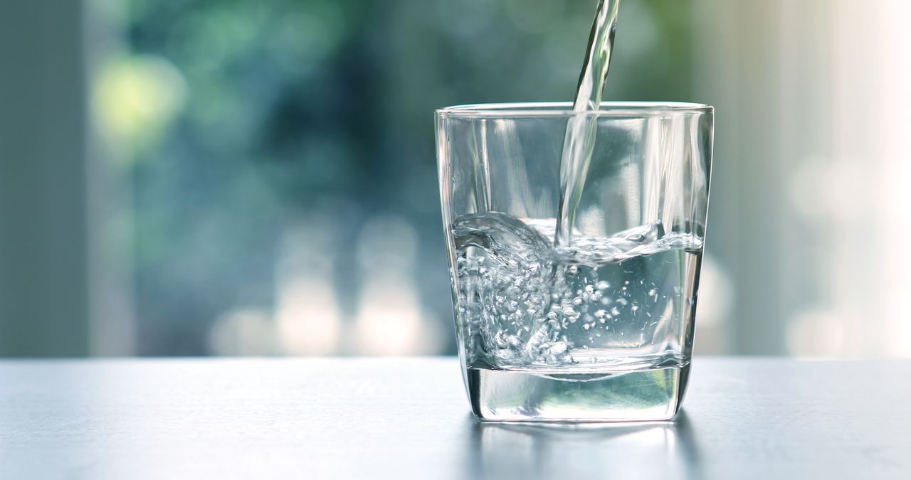 Water pouring into glass.