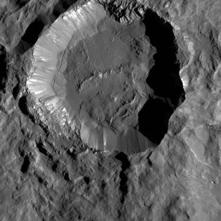 Kupalo Crater, one of the youngest craters on Ceres, shows evidence of salts (the bright materials on its rim and walls). Image taken by the Dawn spacecraft.