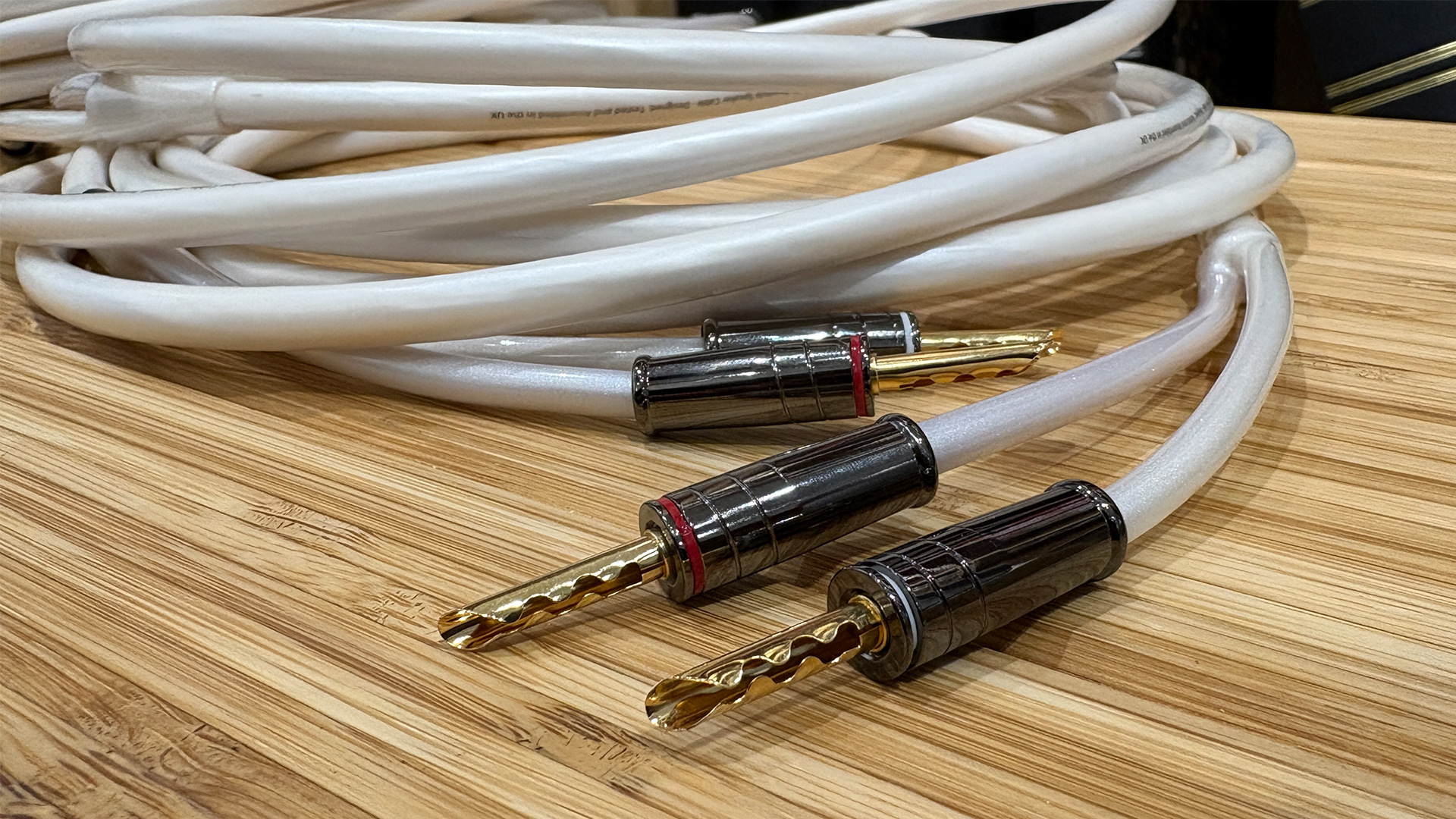 Merlin Tarantula speaker cable on wooden surface