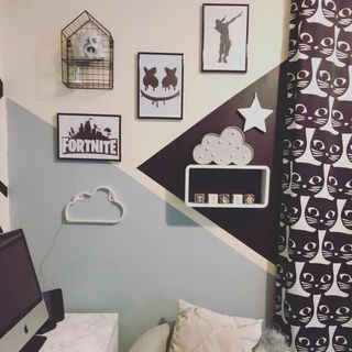 gaming themed bedroom with multicolour wall and photoframe on wall