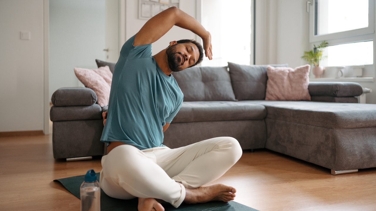 man doing back stretches