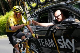 Chris Froome celebrates with his Team Sky director David Brailsford on the final Tour de France stage