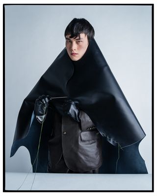 Portrait of a person cloaked in leather