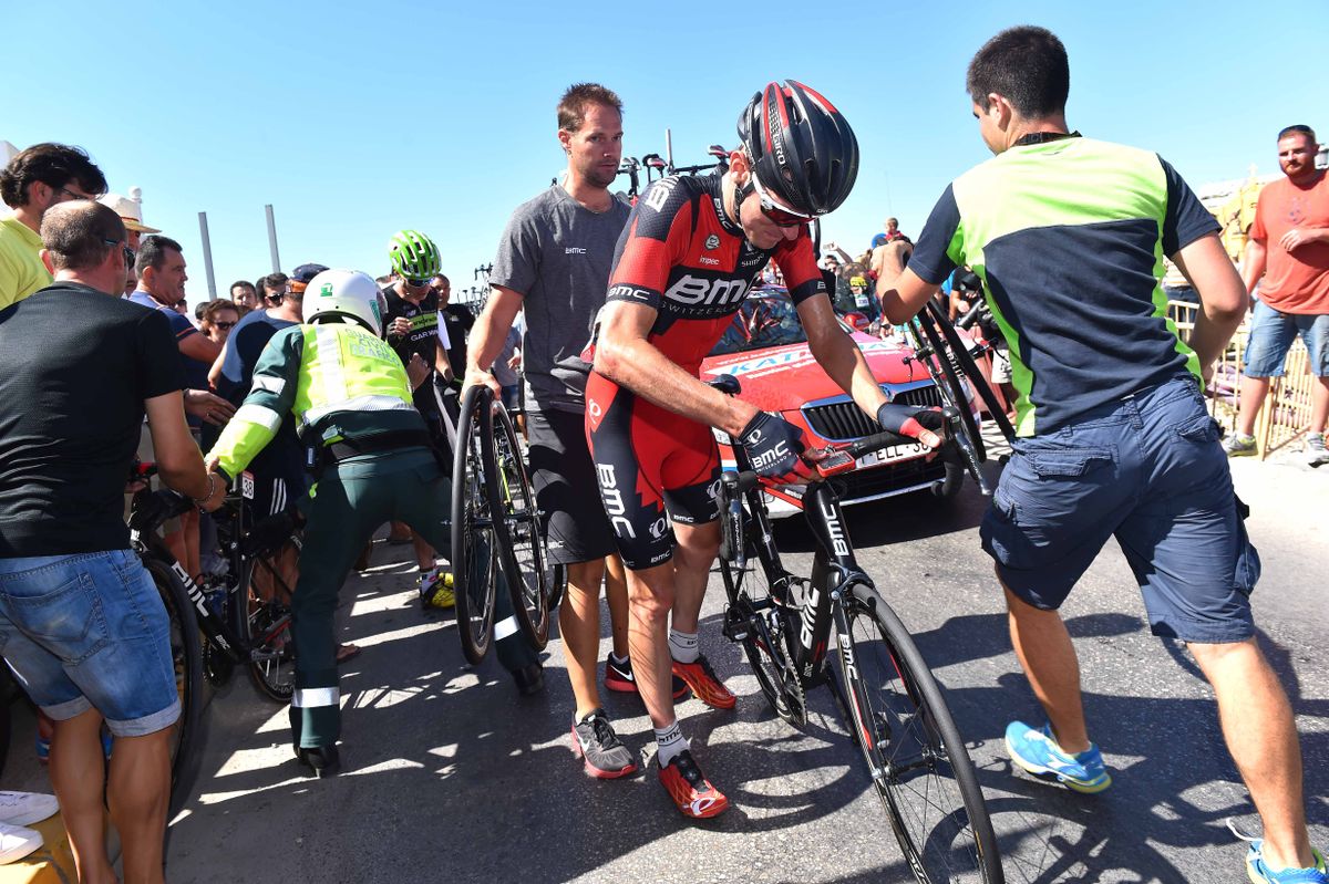 Tejay van Garderen (BMC) gets a spare bike after crashing