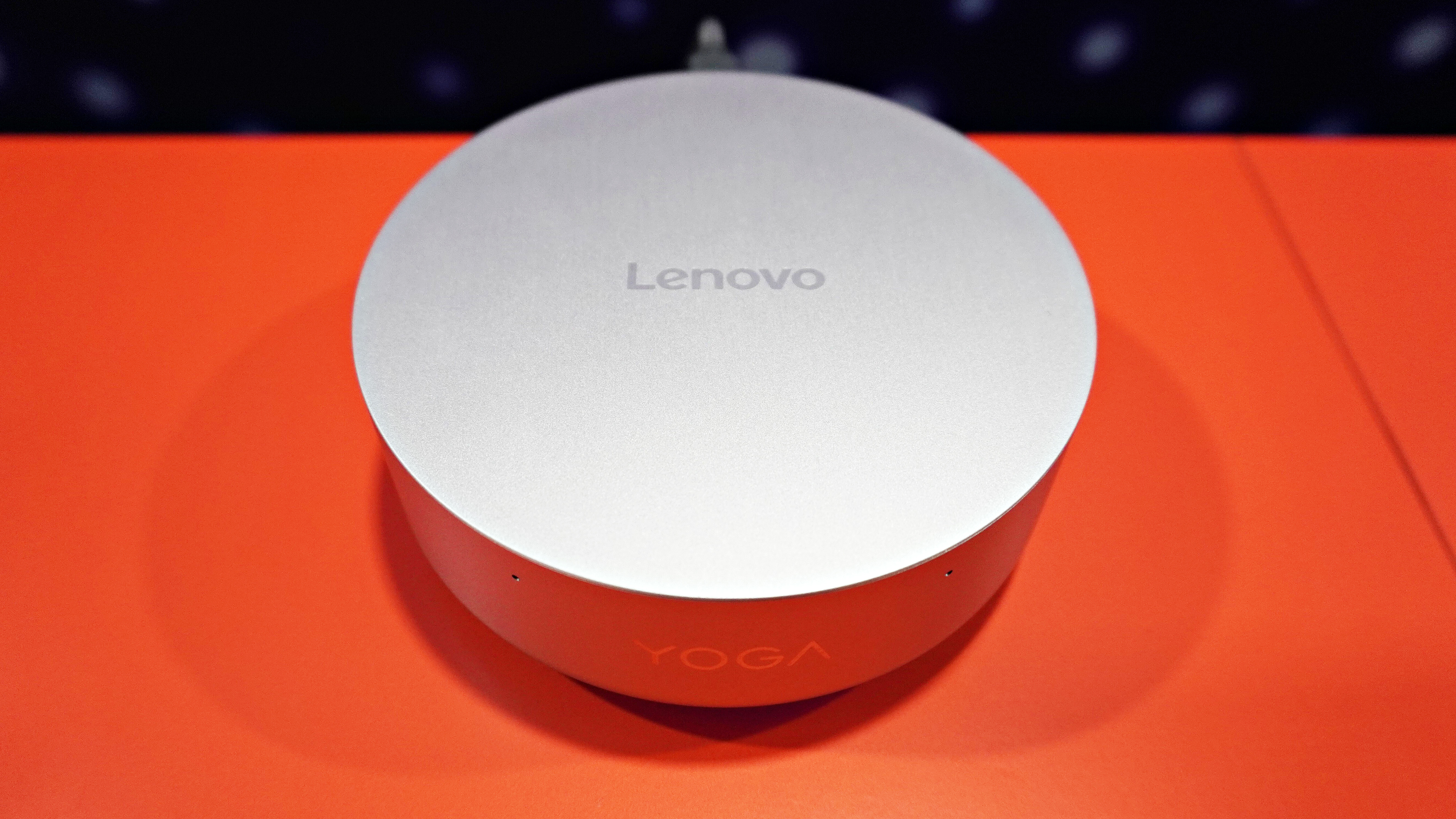 An overhead view of the Lenovo Yoga Mini i mini PC on a table