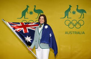 Anna Meares is draped in the Australian flag following the announcement