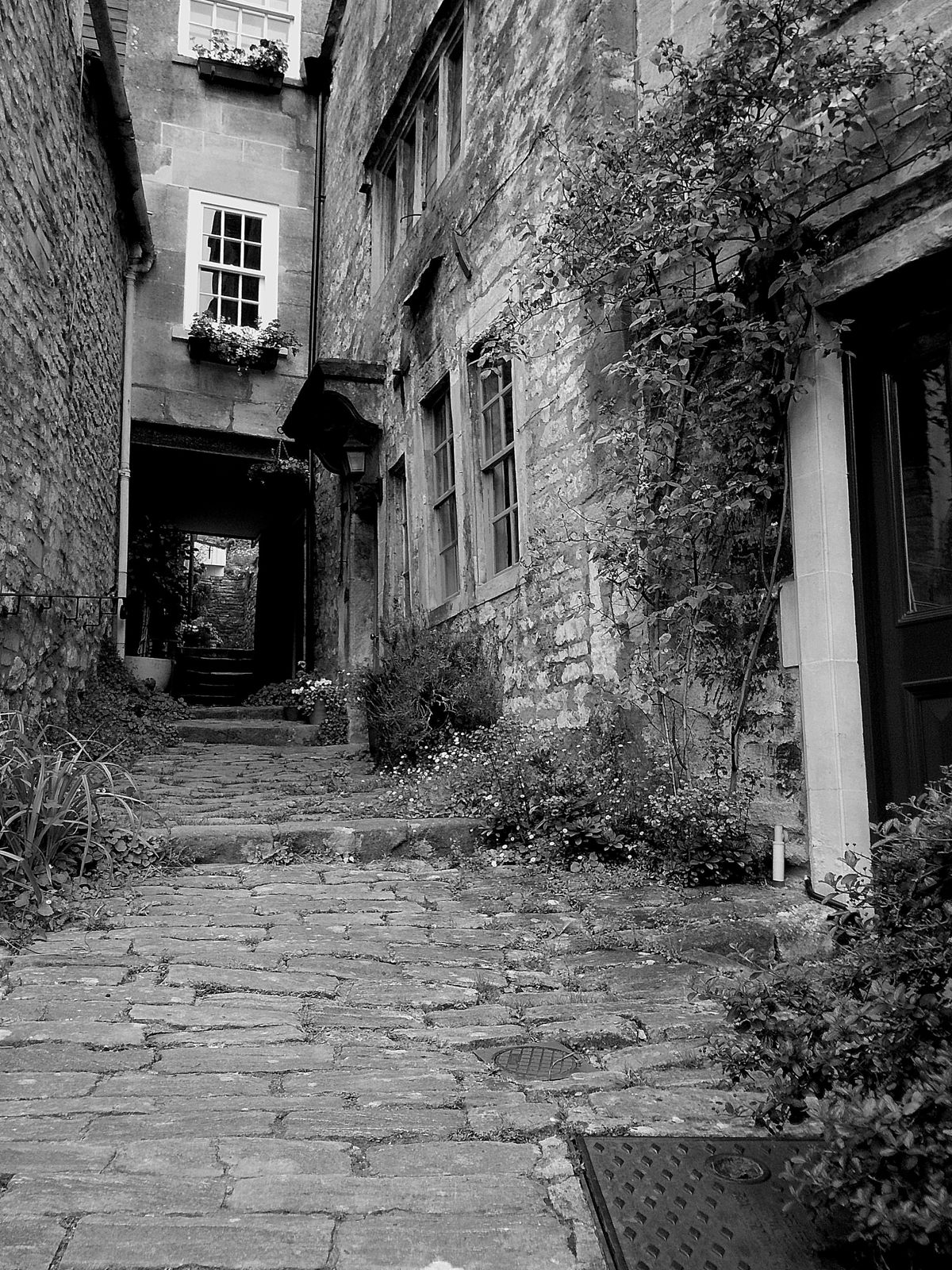 Sample image taken with Camp Snap 2 digital compact camera showing old-fashioned alleyway in monochrome
