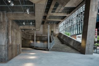 Sony Park Ginza and its brutalist volume, with meshed exterior and concrete interior