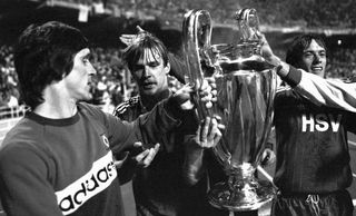 Hamburg players celebrate with the European Cup after victory in the 1983 final over Juventus.