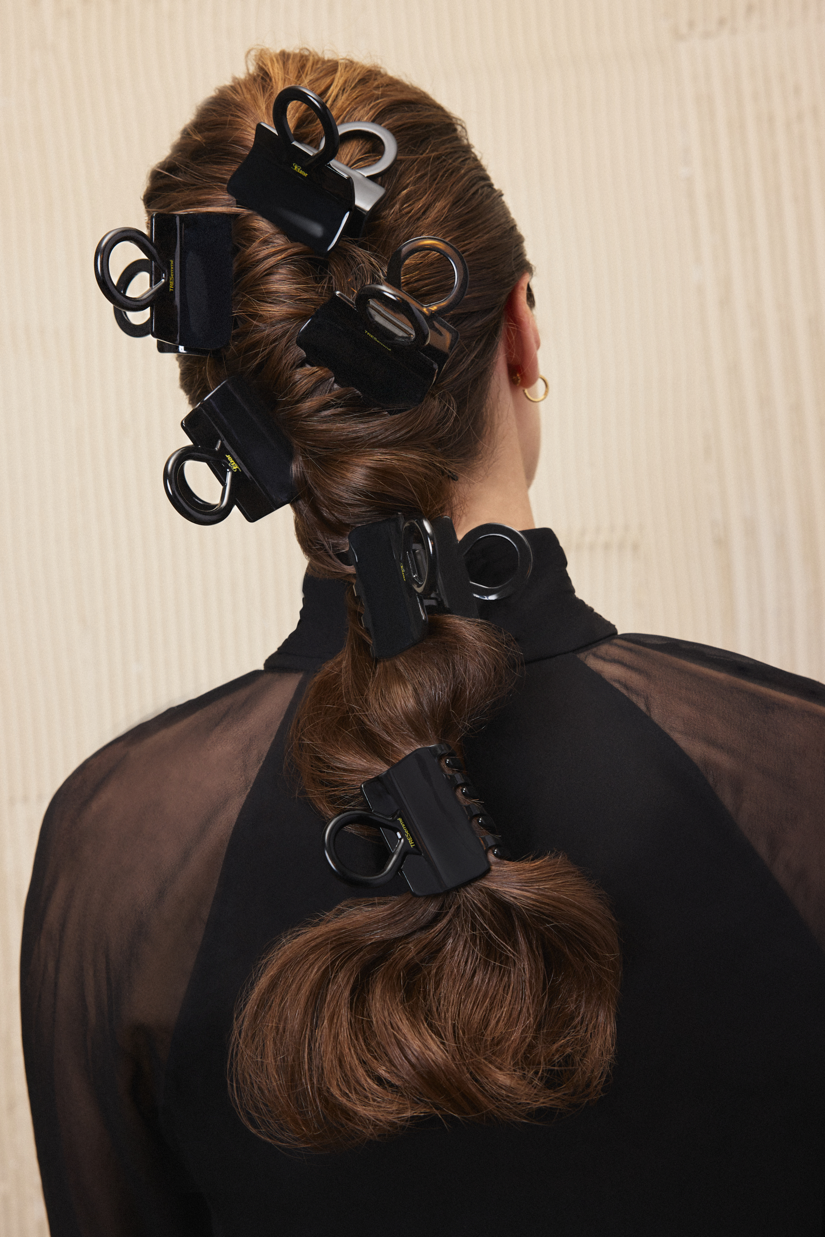 Photo of a model wearing multiple TreSemm&amp;eacute; x Luar claw clips