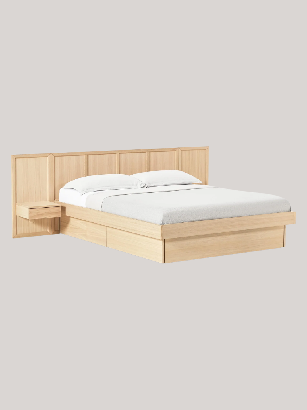 A wooden bed with drawers and a built-in headboard from Westwing
