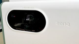 BenQ GS50 home cinema projector close up on lens and BenQ logo