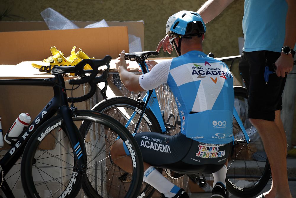 An Irsael Cycling Academy rider readies his machine for a training ride in San Juan