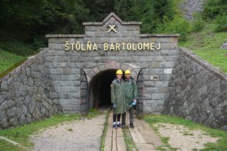 Image shows Anna and Stefan outside the Ondrej mining shaft in Banská Štiavnica, Slovakia