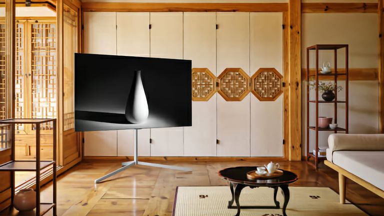 Best LG TV 2022, image shows LG G1 on stand in living room