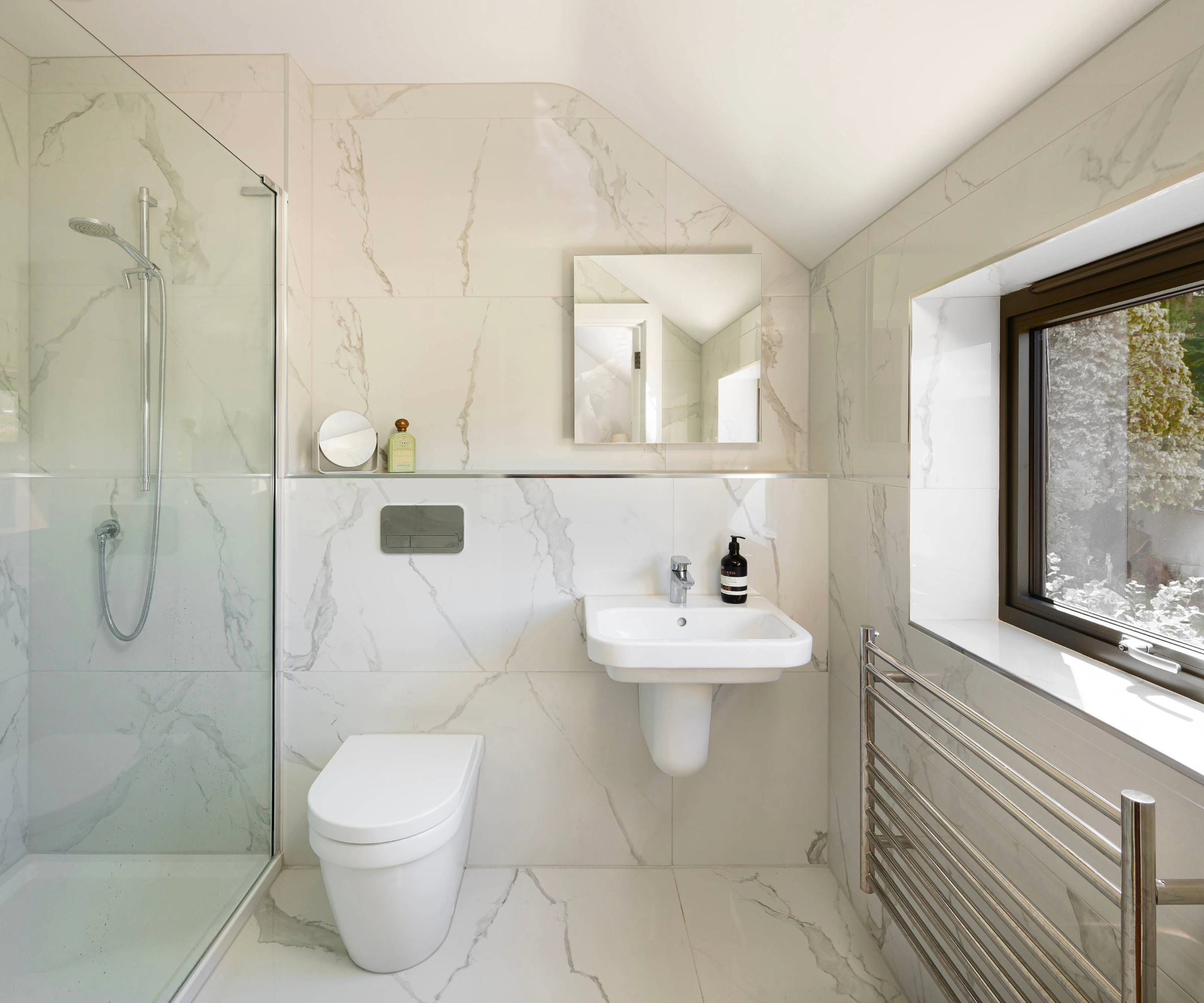 Bathroom with marble flooring and walls
