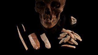 Dated to 7,000 years ago, these stone tools and human male skull were found in Groß Fredenwalde, Germany. It is believed that the people this individual belonged to lived alongside the first Europe farmers without mixing.