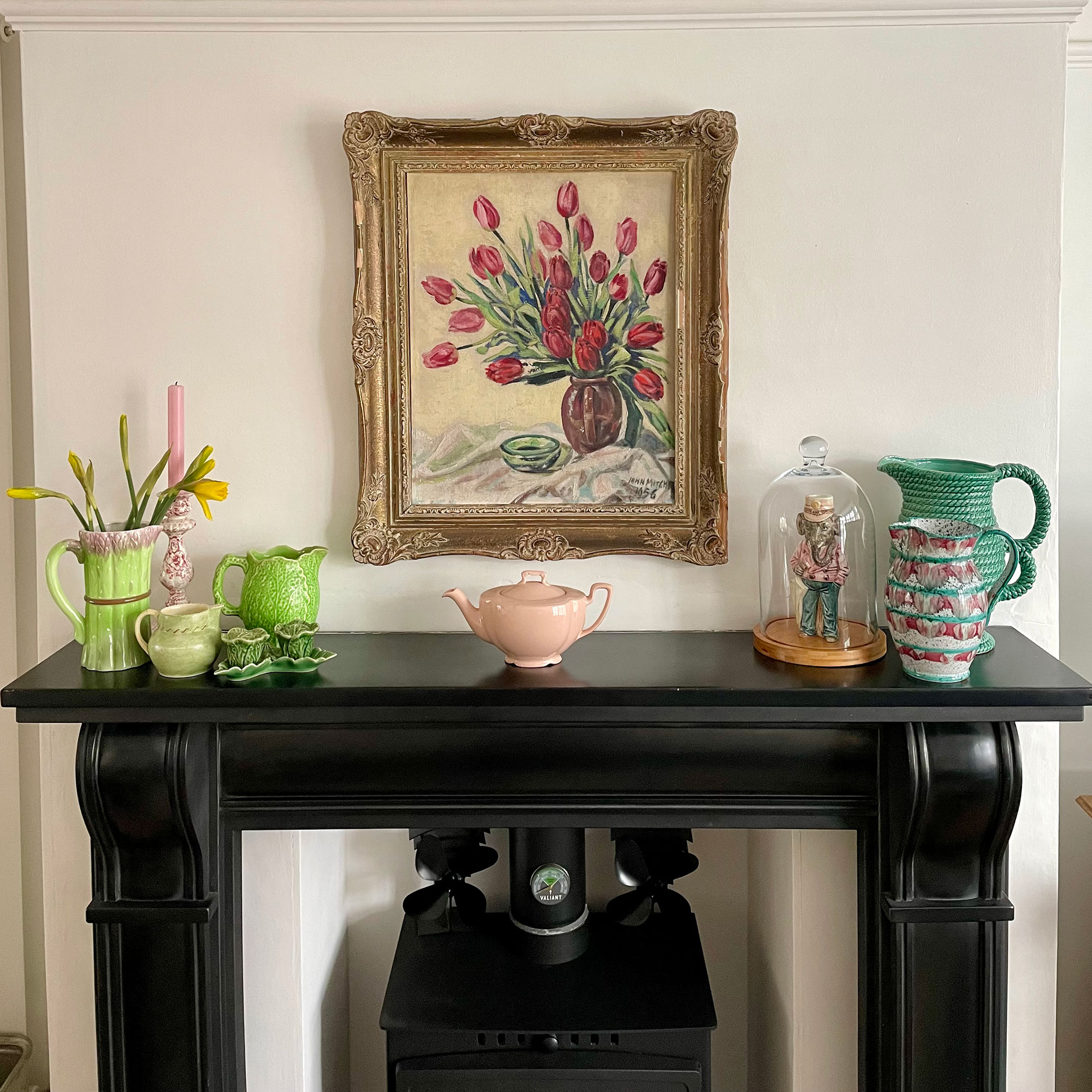 Fireplace mantlepiece with vases and jogs and floral painting