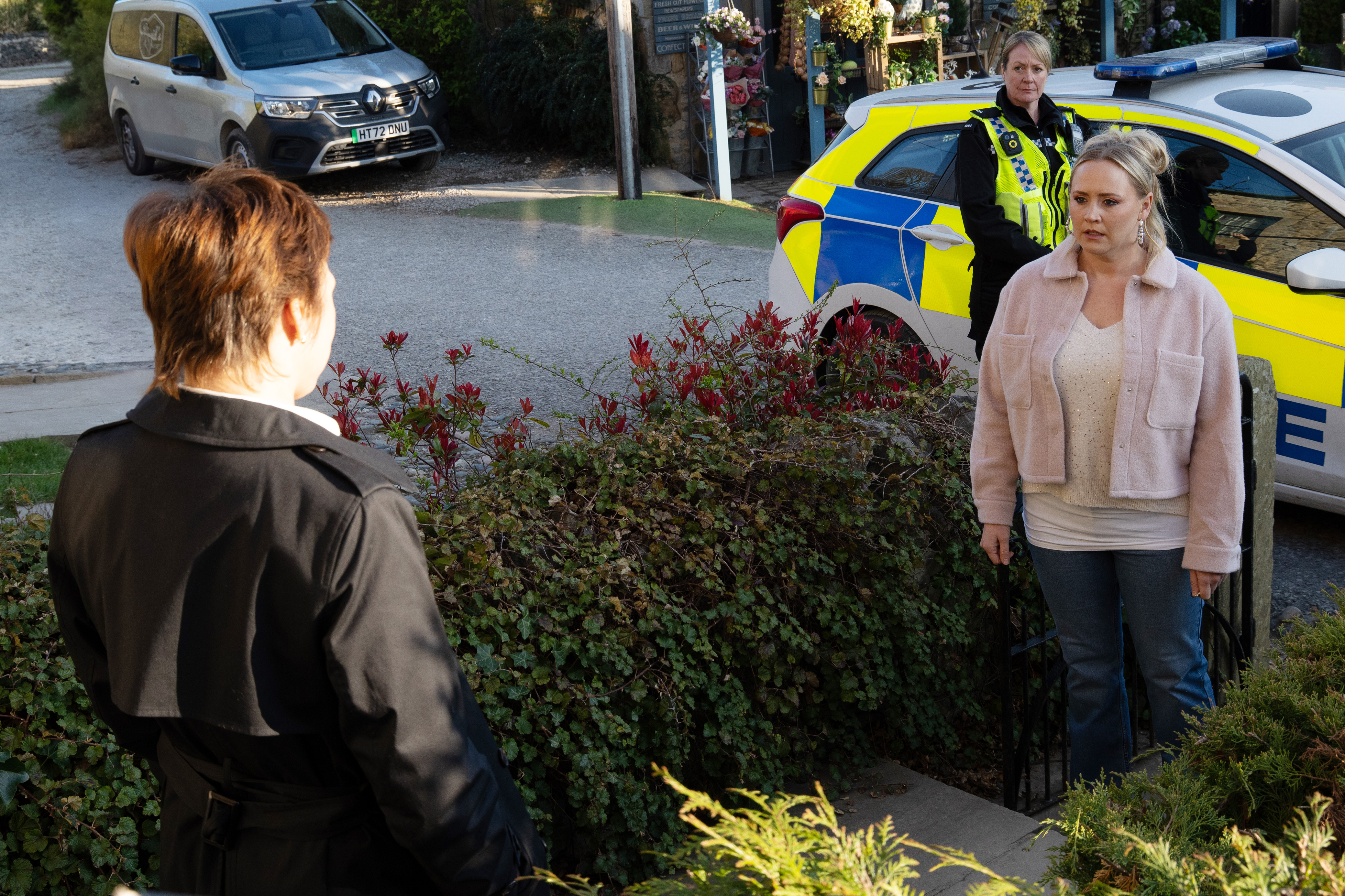Tracy receives a visit from the police